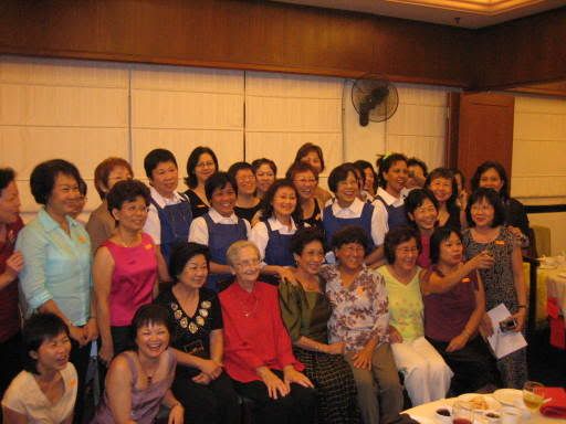 The girls and choir posing with their former teachers